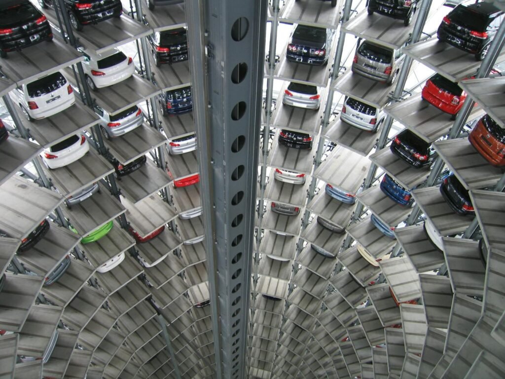 Multi-level automated parking tower with cars stacked on vertical platforms